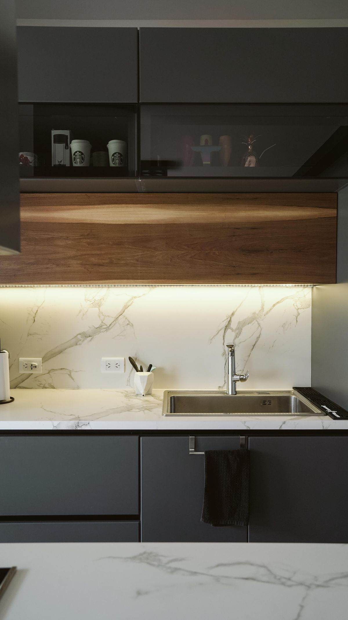 A bright, modern kitchen sink and faucet